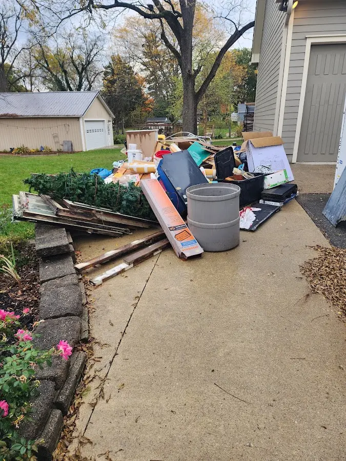 Dumpster being loaded with debris for 30 Yard Dumpster Rental in Cortez